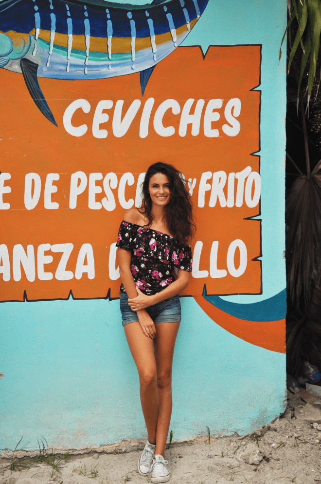 Girl in front of wall punta allen