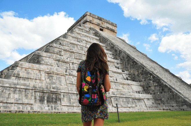 Girl in front of pyramid in chichen itza