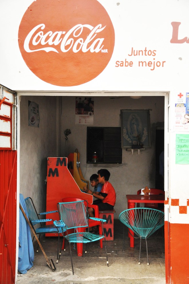kids playing in coca cola shop in mexico