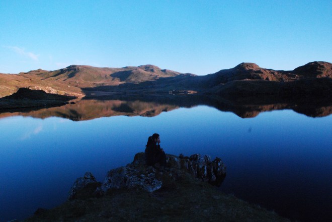 girl on lake at dusk