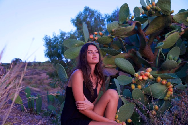 Girl in front of Prickly pears