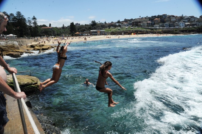 Girls jumping in tamarama