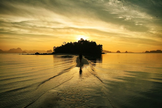 girl on beach thailand at sunrise