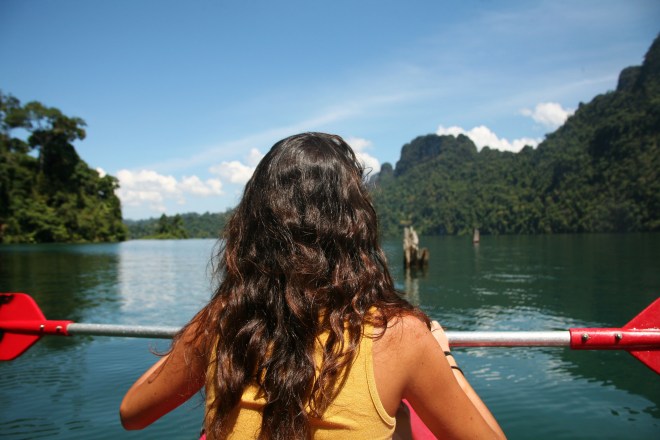 Girl kayaking in Thailand