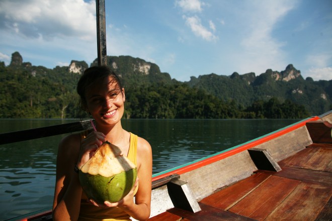 Girl with coconut on longtail