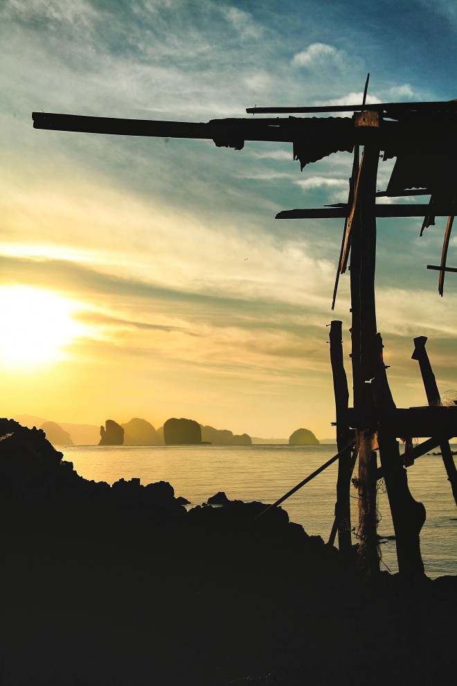 rocks and fisherman hut at sunrise
